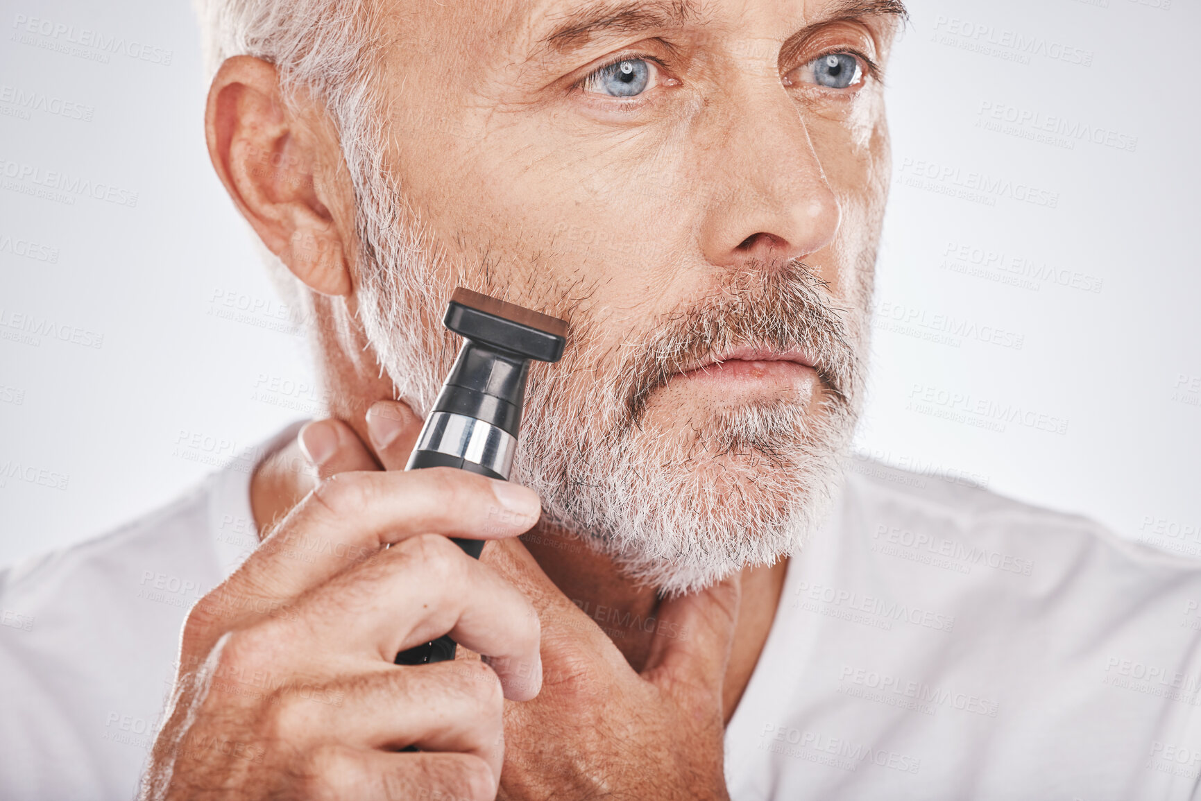 Buy stock photo Senior man, shaving facial hair and grooming beard for skincare, hygiene and wellness with dermatolgy cosmetics. Hair removal, epilation and beauty of elderly male cleaning face on studio background