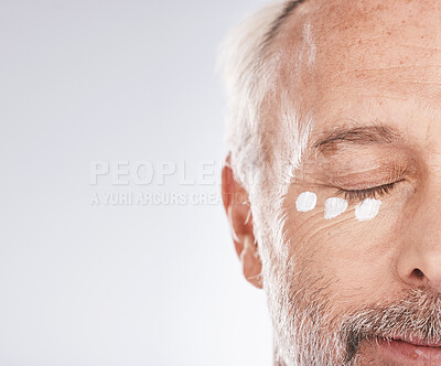 Buy stock photo Skincare, cream and face of senior man on white background for beauty, wellness and dermatology. Cosmetics, grooming and elderly male with anti aging beauty products, facial treatment and lotion