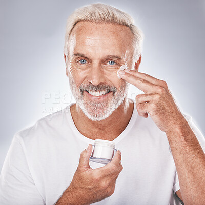 Buy stock photo Skincare, face cream and senior man portrait on white background for beauty, wellness and dermatology. Cosmetics, grooming and elderly male with anti aging beauty products, spa treatment and facial 