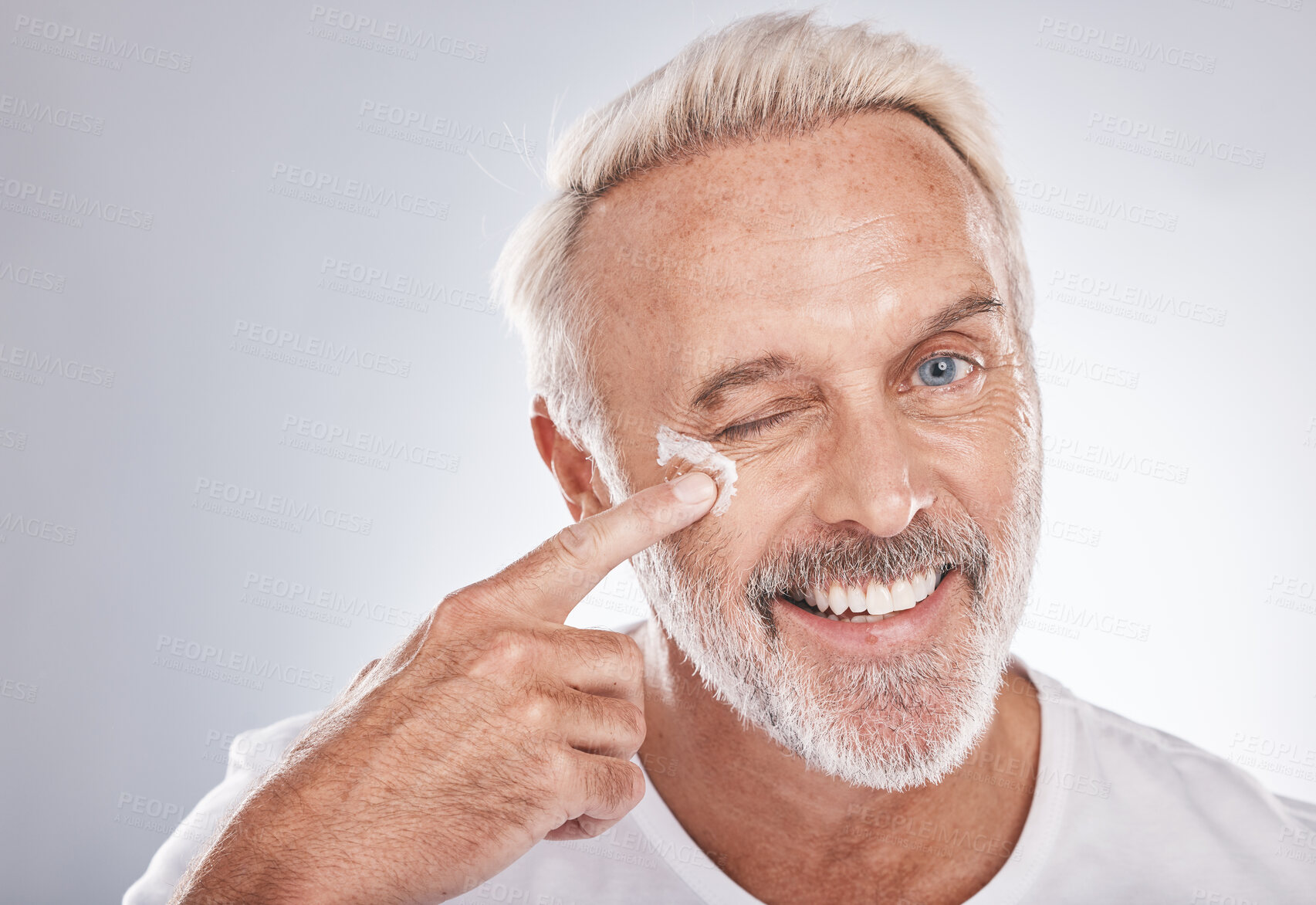 Buy stock photo Skincare, beauty and face cream of senior man on white background for spa, wellness and dermatology. Cosmetics, grooming and elderly male with anti aging beauty products, facial treatment and lotion