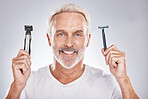 Portrait, senior man and razor for cosmetics, beauty and skincare on grey studio background. Face, mature male and elderly guy with electric trimmer, smile and hair products for hairstyle and happy