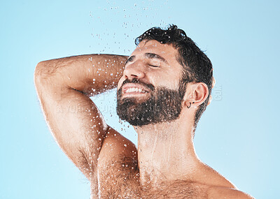 Buy stock photo Shampoo, shower and cleaning with a model man washing his hair in studio on a blue background for natural care. Keratin, treatment and water with a male wet in the bathroom while grooming alone