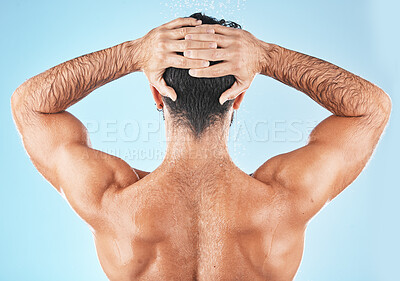Buy stock photo Water splash, man hair and shower for body hygiene, skincare grooming or cleaning care in blue background studio. Model back, self care water cleansing and cosmetics hair care wellness in morning 