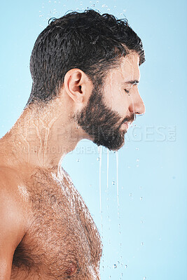 Buy stock photo Water drops, face and man in shower for skincare, cleaning body and hygiene grooming against studio background. Clean, model profile with water and facial, natural treatment and cosmetic care