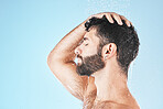 Hair care shower, face and water splash of man in studio isolated on a blue background mockup. Water drops, skincare or profile of male model washing, cleaning or bathing for healthy skin and hygiene