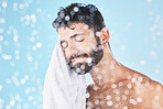 Man, towel with cleaning face and beauty, bokeh overlay with hygiene and grooming against blue background. Skincare mockup with shower, clean cosmetic care and cotton fabric, facial and wellness