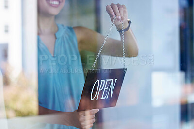 Buy stock photo Small business, woman and entrepreneur with open sign excited at professional shop window entrance. Smile of proud and happy business owner holding sign for store opening with enthusiasm.