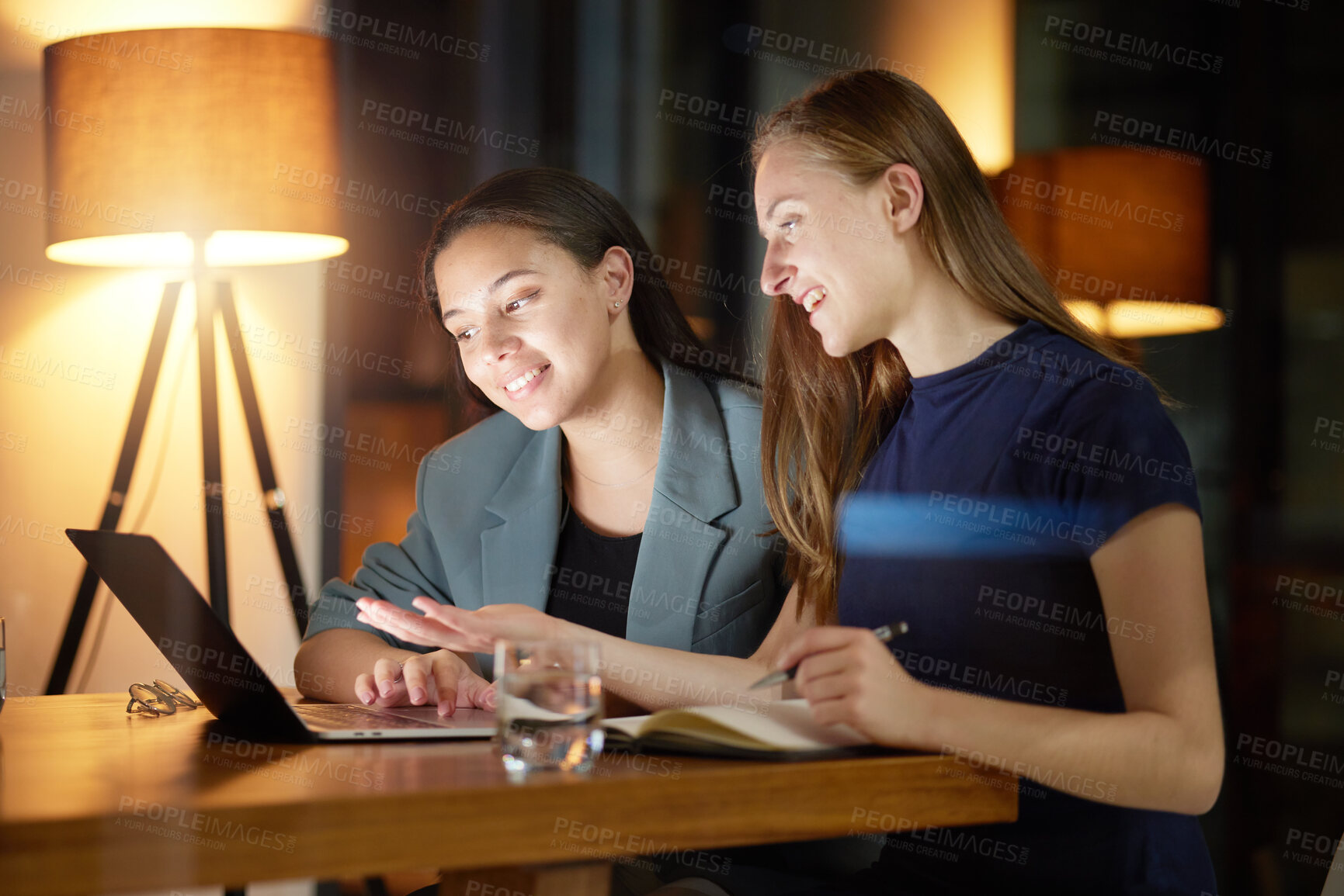 Buy stock photo Business people, laptop and discussion at night in office planning strategy, report deadline and overtime training. Business women talking, late meeting and tech marketing leaders at workplace desk