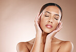 Skincare, beauty and relax, woman with eyes closed and facial massage on studio background. Makeup, glamour and luxury skin care with hands massaging face, mockup for acupressure detox on black woman