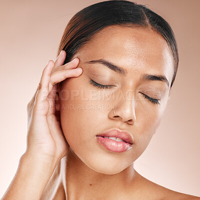 Buy stock photo Skincare, beauty and relax, woman with eyes closed, anti ageing acupressure and hand on face on studio background. Makeup, glamour and luxury skin care with hands on natural spa detox facial massage.