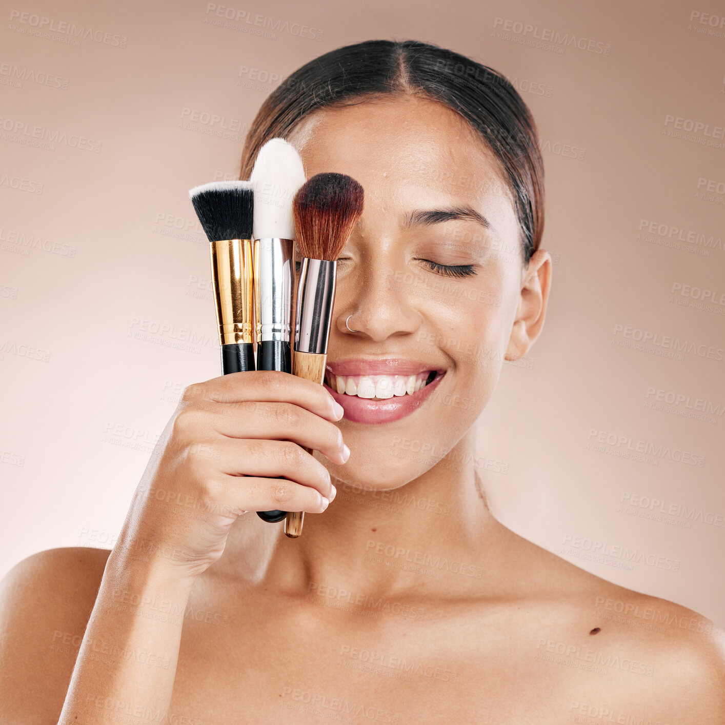 Buy stock photo Makeup, tools and brush with face and woman, beauty cosmetics and wellness against studio background. Facial, treatment and cosmetic equipment, smile and microblading with skincare mockup
