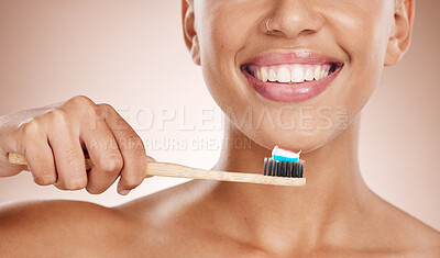 Buy stock photo Woman, cosmetics and brushing teeth for dental hygiene, smile and clean mouth on studio background. Female, girl and tooth brush for oral health, healthcare and fresh breath for natural care or relax