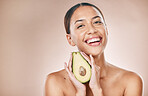 Skincare, beauty and portrait of woman with avocado on brown background for wellness, cosmetics and detox. Luxury spa, aesthetic and face of girl for organic, natural and healthy facial treatment