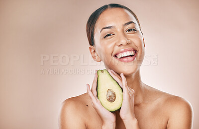 Buy stock photo Skincare, beauty and portrait of woman with avocado on brown background for wellness, cosmetics and detox. Luxury spa, aesthetic and face of girl for organic, natural and healthy facial treatment