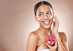 Face, pomegranate cream and woman, beauty facial and wellness with skincare, healthy skin and cosmetic mockup. Glow, shine and vegan moisturizer, fruit and smile for facial with studio background