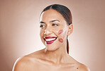 Beauty, makeup and woman with lipstick and cosmetics on a studio background for dermatology, fashion and salon mockup. Face and headshot of aesthetic female model with a smile, glow and healthy skin