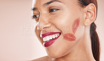 Buy stock photo Makeup, lipstick and beauty of a happy woman with color or shade of cosmetics on a studio background. Face of aesthetic model with a smile, glow and healthy skin for dermatology and salon mockup
