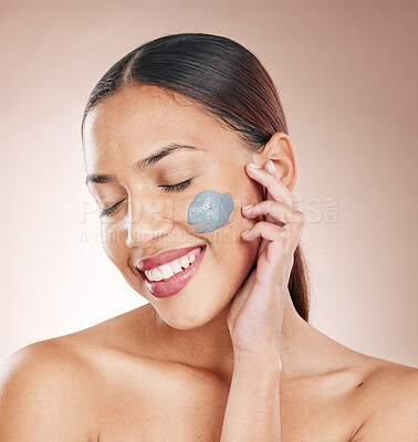 Buy stock photo Face mask, skincare and woman model in a studio for a cosmetic, wellness and natural routine. Cosmetics, beauty and female from Brazil with a charcoal facial treatment isolated by a brown background.