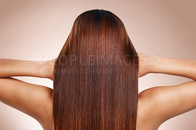 Buy stock photo Hair, beauty and back of woman in studio for hair care, hair products and cosmetics on beige background. Salon, balayage and girl touch healthy, shine and long hair for hair salon, treatment and glow