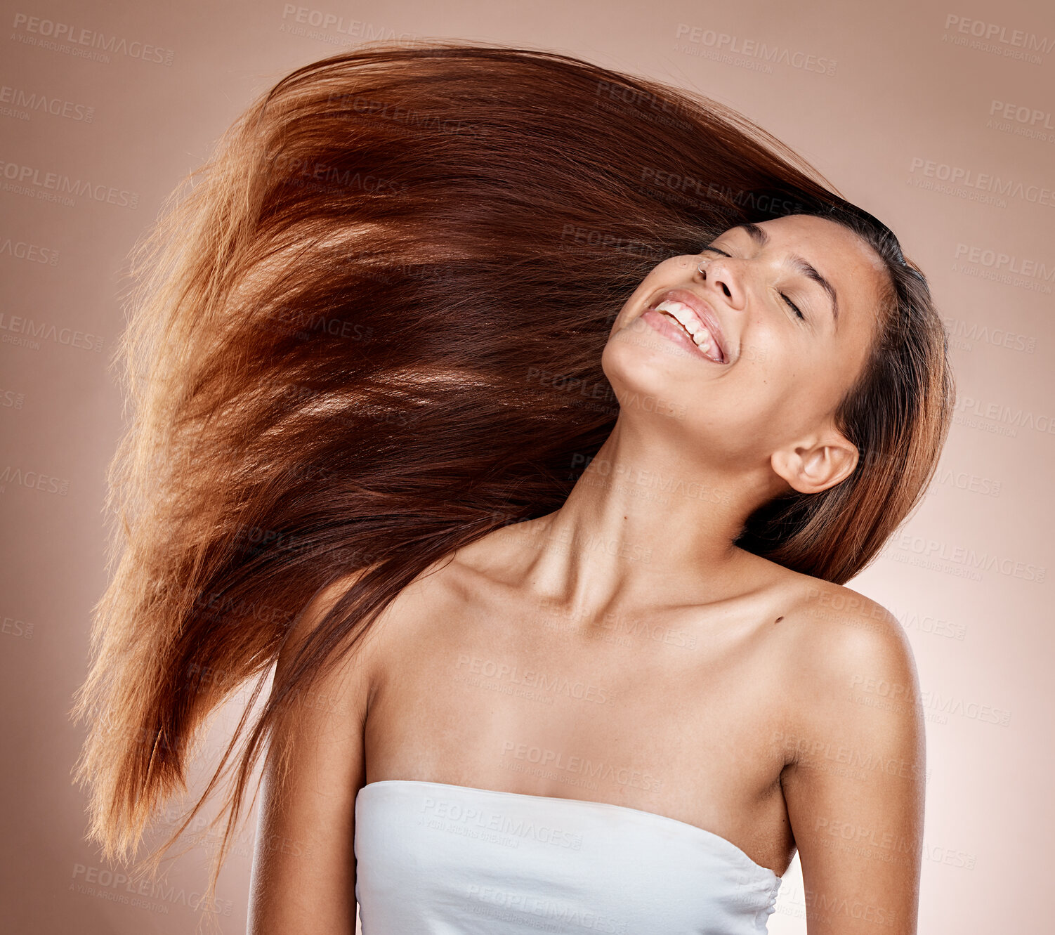 Buy stock photo Hair care, beauty and woman in a studio with healthy, long and brown hair after a salon hair style. Cosmetics, happy and female model from Brazil with a keratin or botox treatment by brown background