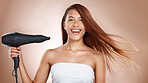 Hair care, beauty and cosmetics of a woman with hairdryer on studio background for luxury keratin treatment with shampoo product. Headshot of female posing for salon, hairdresser and wellness mockup