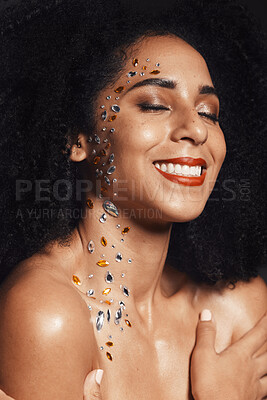 Buy stock photo Woman, face or body jewel rhinestones on black background studio for fashion sparkle, festival accessory or creative party crystals. Happy smile, afro beauty model and skin gems with makeup cosmetics