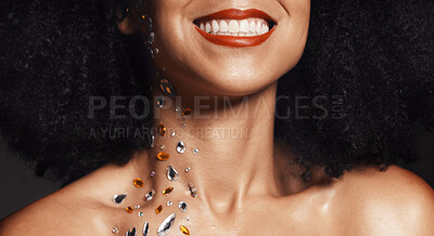 Buy stock photo Woman face, fashion jewelry or body art rhinestones on black background studio in festival diamonds sparkle or creative party crystals. Zoom, happy smile or beauty model skin and makeup cosmetic gems