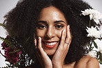 Portrait, beauty and flowers with a model black woman in studio on a gray background touching her face. Skincare, plant and cosmetics with an attractive young female posing to promote natural care