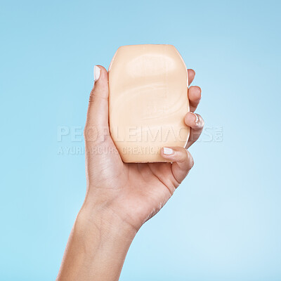 Buy stock photo Soap, product and beauty with hand of woman for skincare, shower and cleaning. Spa, luxury and wellness with model and cosmetics soap bar for treatment, self care and hygiene in studio background 