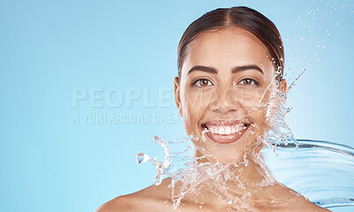Buy stock photo Happy woman, face skincare or water splash on blue background studio in healthcare wellness, hygiene maintenance or grooming mockup. Smile portrait, beauty model and facial water drop in wet cleaning
