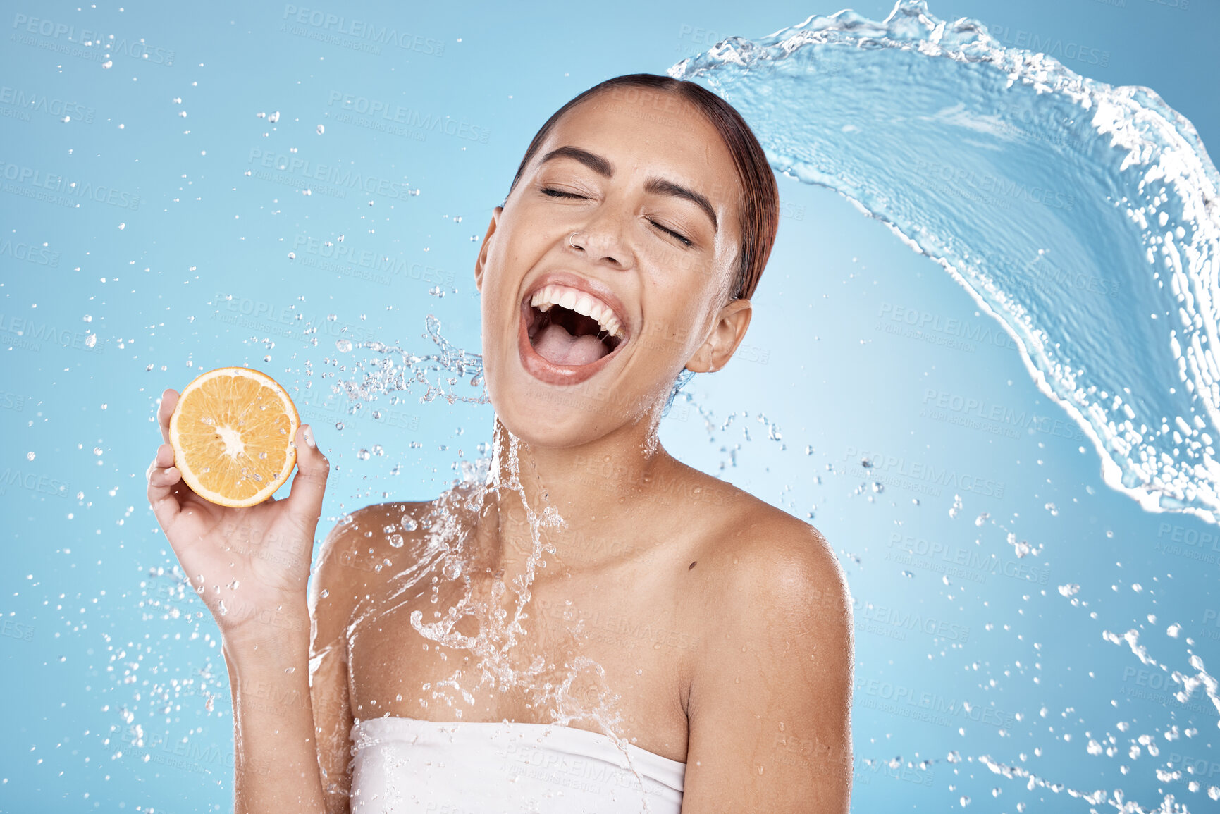 Buy stock photo Water splash, beauty and woman, clean with orange for organic cosmetic care and hygiene in shower. Water, fruit and vegan skincare treatment with splash and excited female against studio background