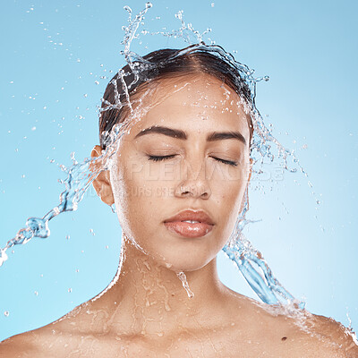 Buy stock photo Woman, washing face or water splash skincare on blue background studio in healthcare wellness, Brazil bathroom hygiene or self care grooming. Beauty model, water drop or facial cleaning in wet shower