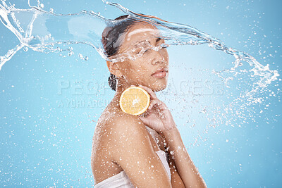 Buy stock photo Beauty, water splash and woman with a lemon for skincare, wellness and health with a face routine in a studio. Cosmetic, healthy and female model with a citrus fruit for a natural facial treatment.