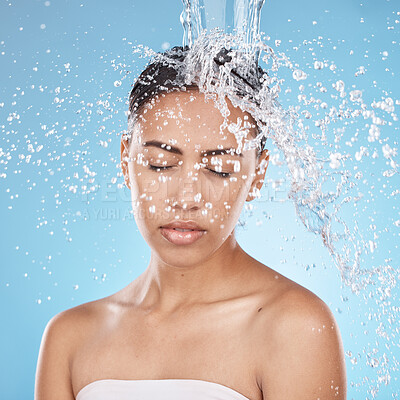 Buy stock photo Woman, washing hair or water splash skincare on blue background studio in healthcare wellness, dermatology grooming or hygiene cleaning. Beauty model, wet or water drops in bathroom shower hair care