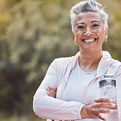 Water, bottle, black woman portrait and of a athlete in a gym after workout  and sport. Hydration, d Stock Photo by YuriArcursPeopleimages