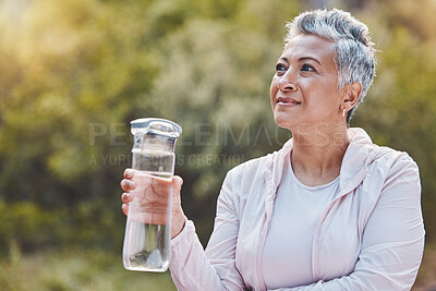Buy stock photo Face, water bottle and senior woman in nature on break after sports workout, exercise or training. Thinking, drinking water and retired female from India with liquid for hydration, health or wellness