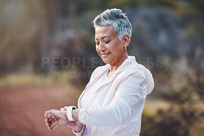Buy stock photo Smartwatch, exercise and senior woman on nature trail for running, cardio and a fitness app workout. Elderly female with a watch in a forest to run for healthy lifestyle, body and energy with cardio