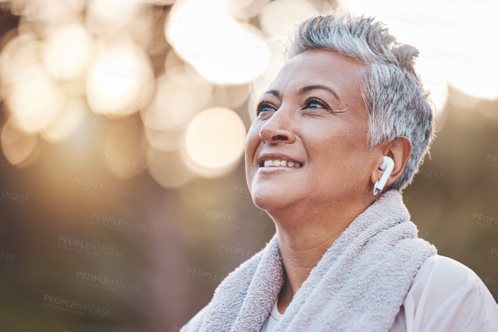 Buy stock photo Fitness, exercise and senior woman listening to music in nature with earphones for running , thinking and wellness. Face of an elderly female outdoor to run for a healthy lifestyle, body and energy