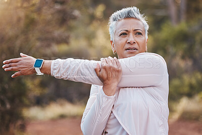 Buy stock photo Exercise, stretching and senior woman outdoor in nature for running, cardio fitness and a workout with a smartwatch. Elderly female in a forest for cardio training for a healthy lifestyle and body