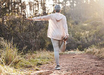 Buy stock photo Fitness, forest or senior woman stretching in nature to start training, exercise or hiking workout in New Zealand. Back view, balance or healthy elderly person with focus, body goals or motivation 