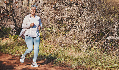Buy stock photo Fitness, happy and senior woman running in nature for cardio, morning motivation and marathon training in Australia. Freedom, wellness and elderly runner with a smile for outdoor exercise in a park
