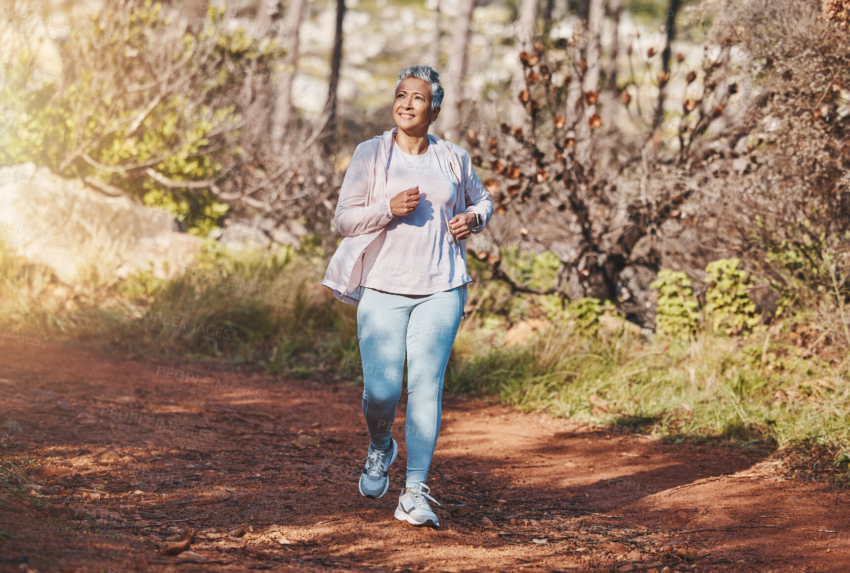 Buy stock photo Fitness, happy or old woman running in nature cardio training, exercise or workout in New Zealand. Runner, freedom or healthy senior person smiles with pride, body goals or motivation in summer