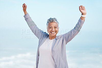 Buy stock photo Fitness, hands in air and senior woman for exercise, fitness or workout portrait goals, success and achievement on blue sky mockup. Winner, freedom and healthy celebration of elderly runner in nature