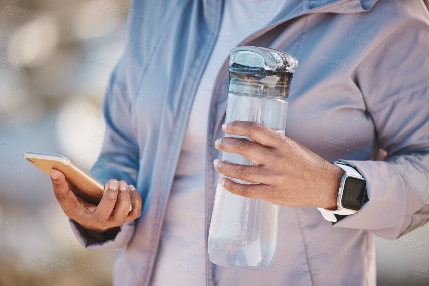 Buy stock photo Fitness, water and phone with hands of woman in mountain for jogging, workout or cardio training. Social media, progress tracker and running app with runner on path checking mobile for endurance goal