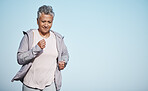 Senior woman, fitness running and blue sky outdoor exercise for retirement sports wellness, health workout and cardio training. Elderly athlete, focus and runner freedom and marathon lifestyle 
