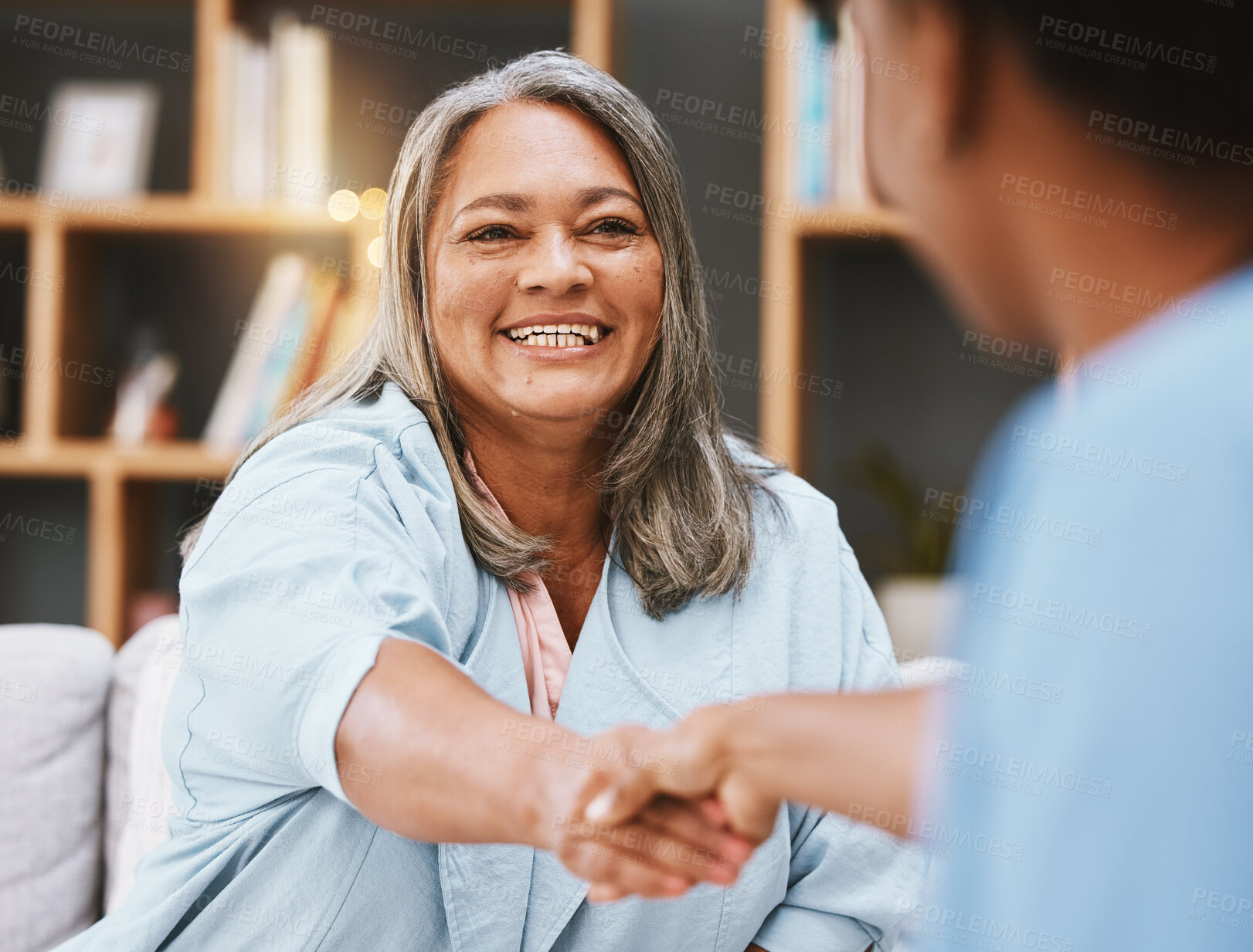 Buy stock photo Handshake, healthcare and appointment with a senior woman shaking hands with a female nurse in a retirement home. Thank you, medical and meeting with a mature patient and medicine professional