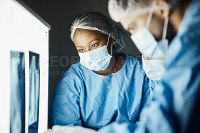 Buy stock photo X ray, exam and covid doctors meeting for a healthcare diagnosis, medical inspection and research results. Strategy, teamwork and surgeon workers doing analysis of a body scan with face mask