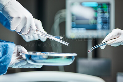 Buy stock photo Doctors hands, surgery team and tools in icu, hospital or healthcare with tweezers, bullet or metal. Surgeon, health and emergency theater with scissor, bowl or ppe for safety, medical work or clinic