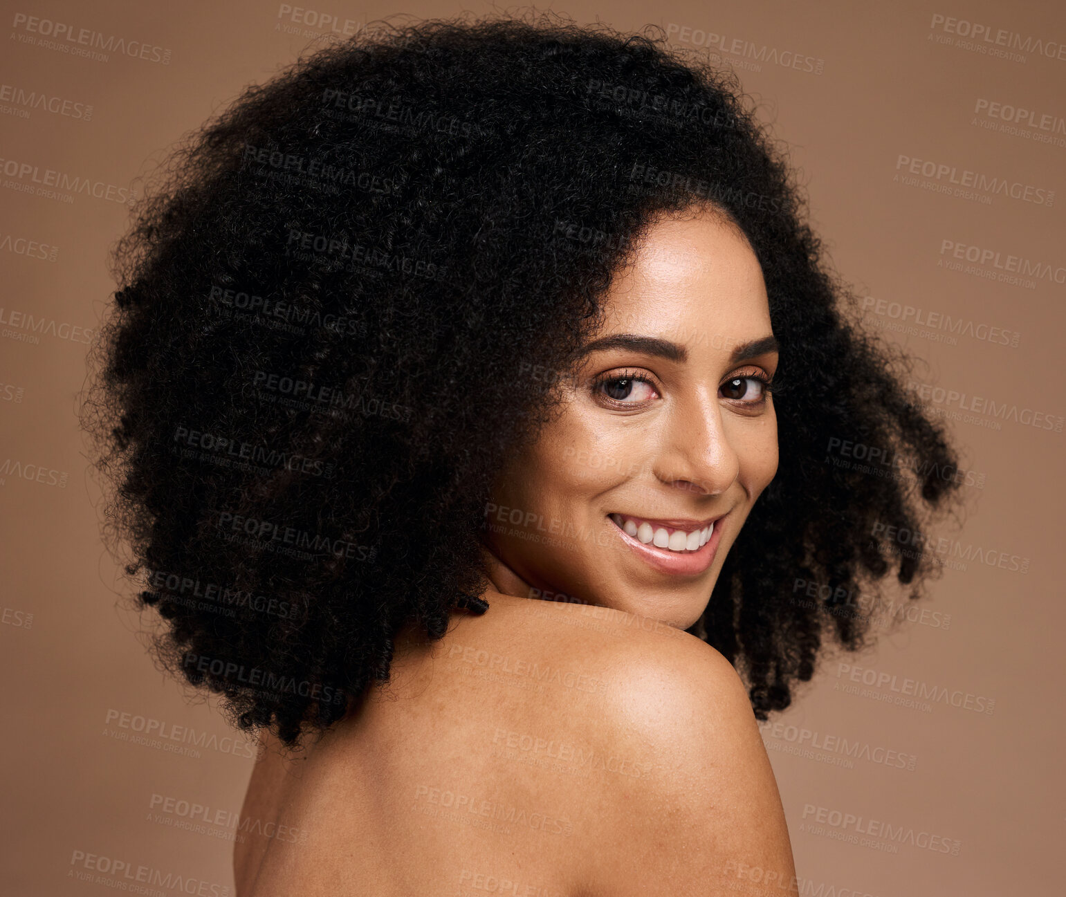 Buy stock photo Black woman, studio portrait and beauty with smile, cosmetic glow and healthy with afro by backdrop. Model, skincare and natural hair care for aesthetic, wellness and self care by brown background