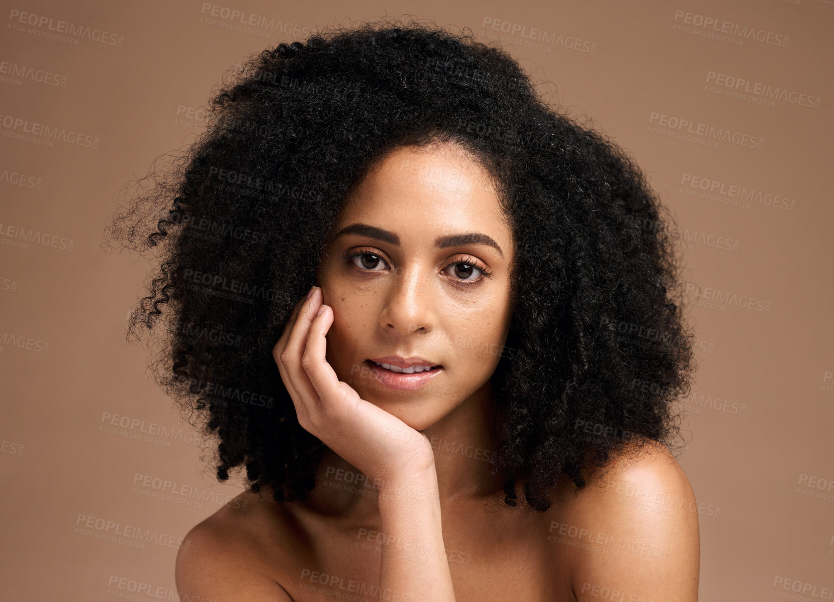 Buy stock photo Black woman, studio portrait and beauty with skincare, cosmetic glow and thinking with afro by backdrop. Model, makeup and natural hair care for aesthetic, wellness and self care by brown backdrop